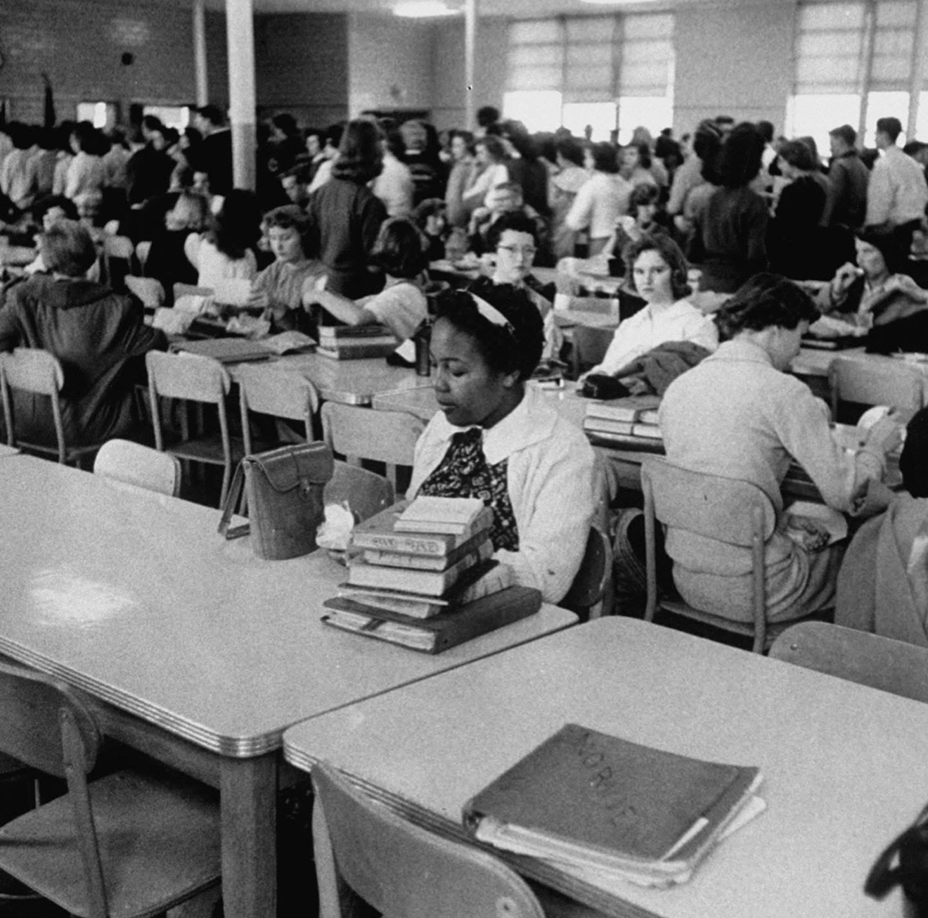 Patricia Godbolt White as one of the Norfolk 17, sitting alone in a school cafeteria during desegregation